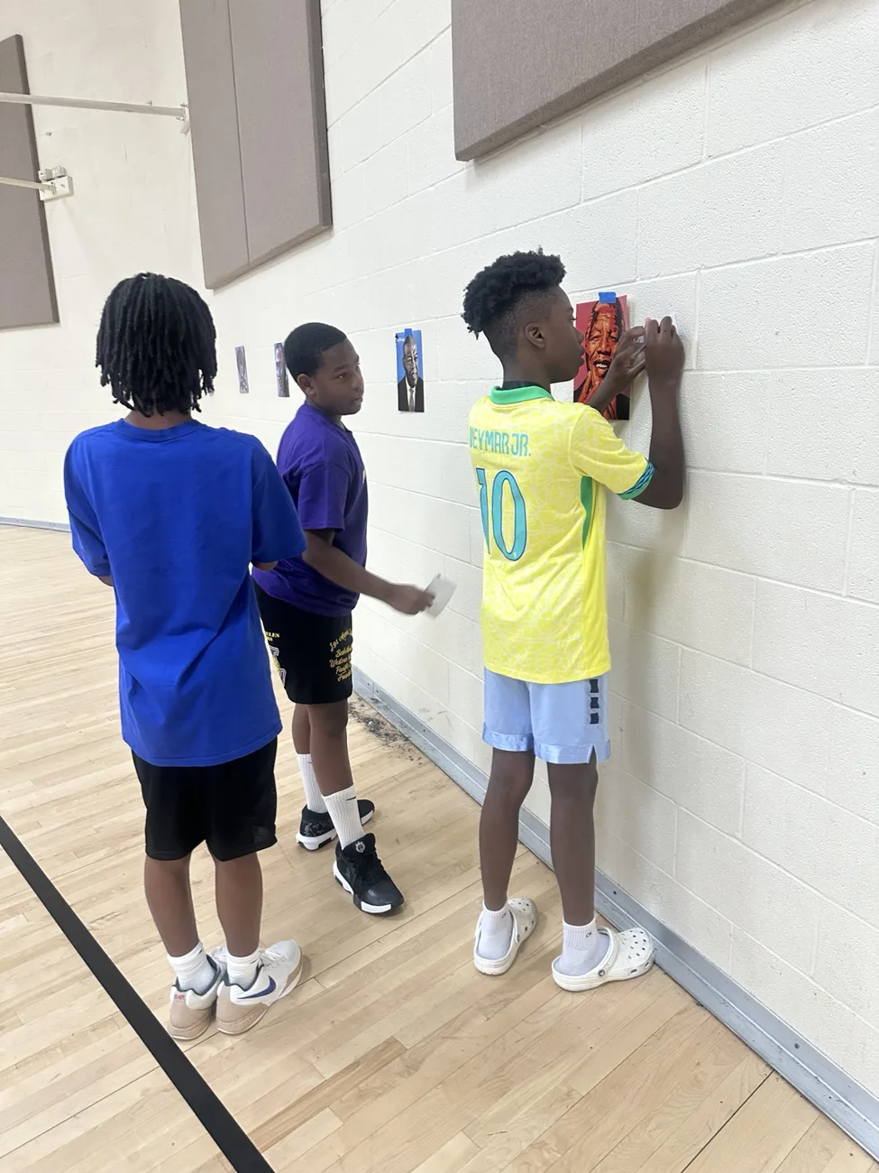 Students collaborating on a wall activity
