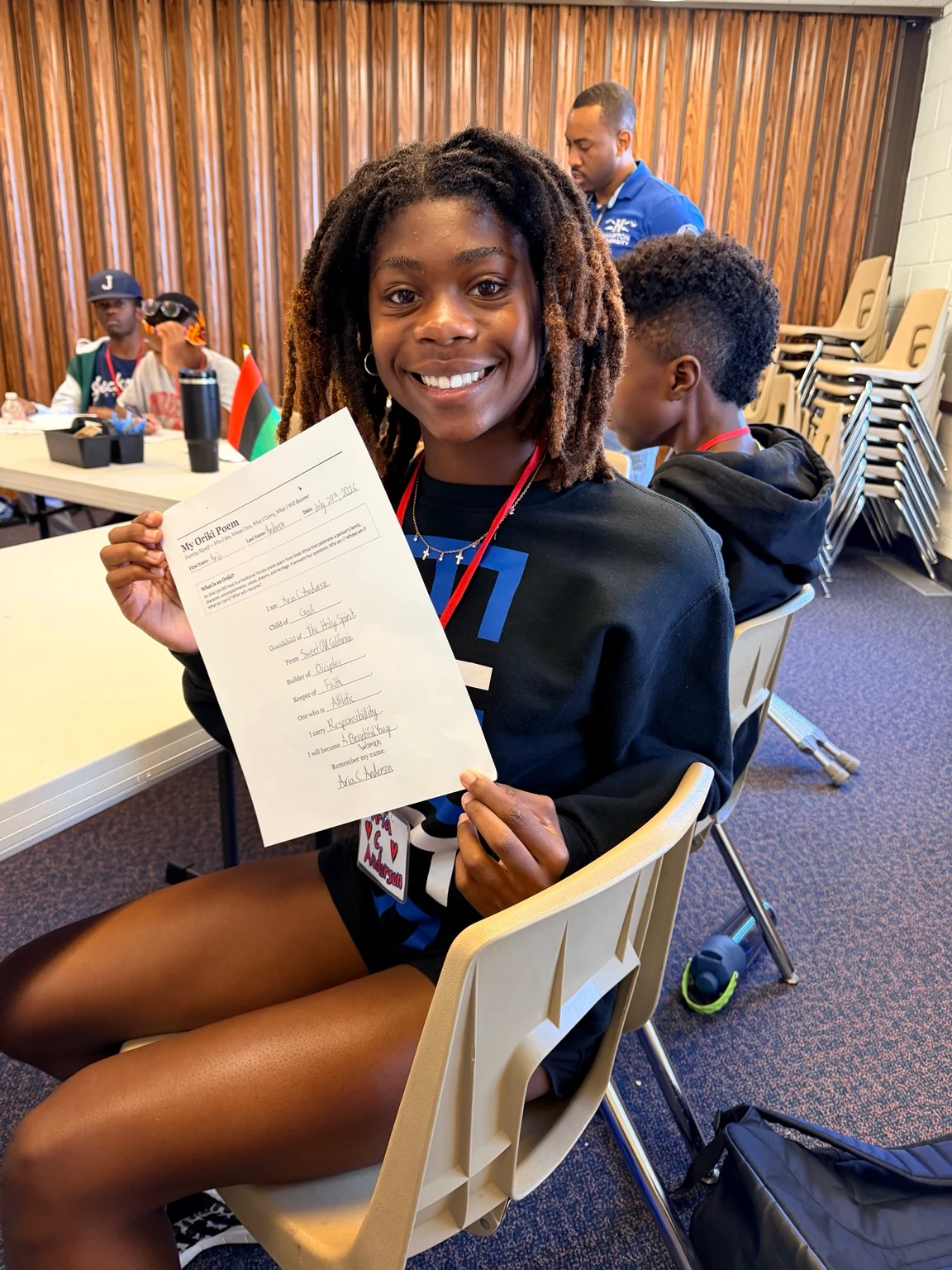 A Freedom School scholar sharing an original oríkì identity poem